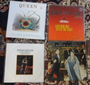 Collection of vinyl records (albums) by Queen including 'The Show must go on', 'Return of the