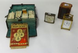 A Mah-jong Game in leather case with instructions etc also a carriage clock and travel case