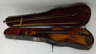 An old violin and two bows, cased.