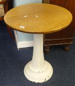 A ships pedestal table with patterned iron and overpainted base and circular hardwood top.