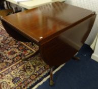 A reproduction mahogany drop flap dining table.