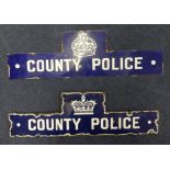 Two 'County Police' enamel signs.