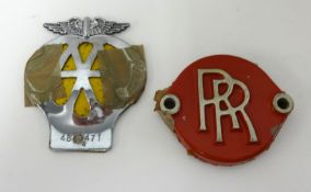 A Rolls Royce (RR) radiator cap and an AA badge (2).