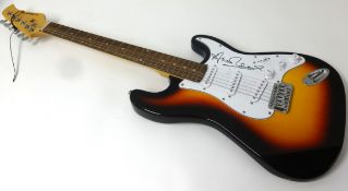 A guitar, signed by Annie Lennox, with certificate.