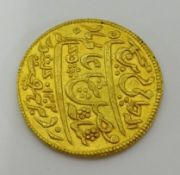 A 19th/20th century gold coin, possibly Indian, 12 gms.