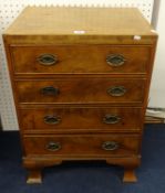 A small mahogany chest fitted with four drawers.