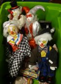 A collection of modern decorative clown puppets.