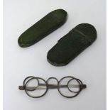 Two 19th century shagreen spectacle cases, one with a pair of steel spectacles