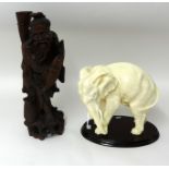 A Chinese carved wood figure table lamp and an overpainted elephant model