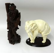 A Chinese carved wood figure table lamp and an overpainted elephant model