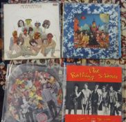 Collection of vinyl records (albums) by the Rolling Stones including 'Almost hear you sigh', 'Rolled