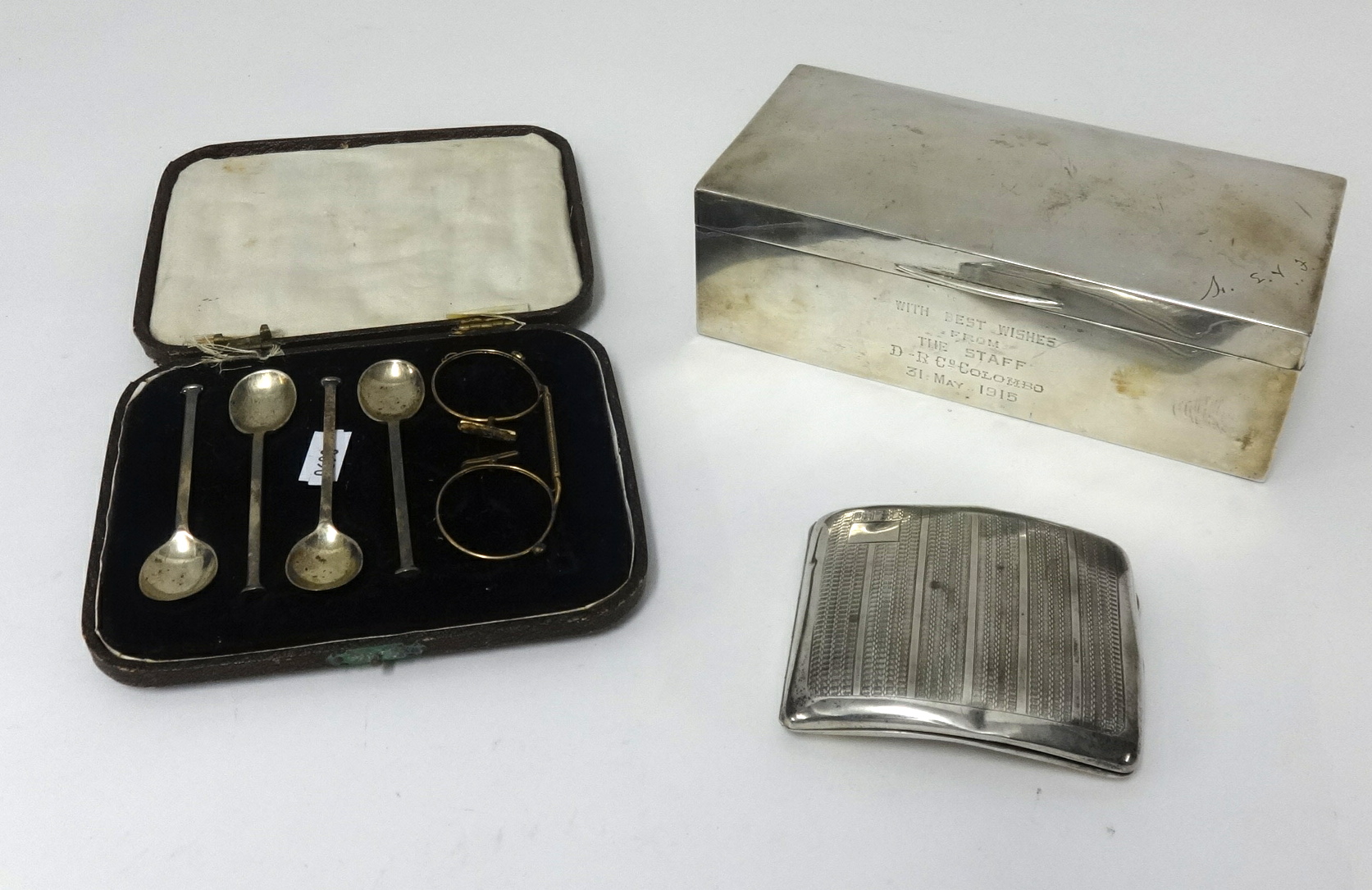 A rectangular silver cigarette box, with personalised inscription dated 1915, 19cm x 9cm, also a