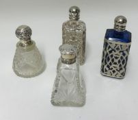 Two old scent bottles in ornate silver cases and two modern silver case bottles (4).