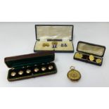 Various gold and other cufflinks and studs.