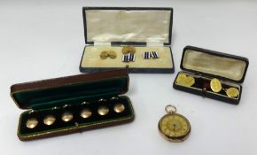 Various gold and other cufflinks and studs.