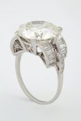 A fine and impressive large Diamond Ring, in platinum set with a round brilliant cut diamond set