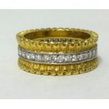Buccellati, a fine 18ct yellow gold band ring set with a full row of diamonds, stamped ‘