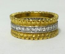 Buccellati, a fine 18ct yellow gold band ring set with a full row of diamonds, stamped ‘