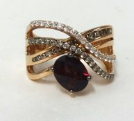 A 14ct rose gold Rhodolite and diamond contemporary ring, diamond weight approx .75 carats, coloured