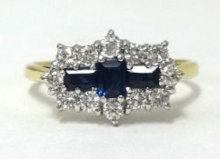An 18ct gold, diamond and sapphire ring, set with 3 baguette cut sapphires and a cluster of 12