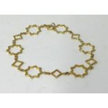 Tiffany, an 18ct gold bracelet, stamped ‘T & C , 750’, of star design, approx 6.20gms.