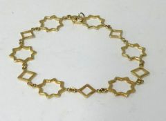 Tiffany, an 18ct gold bracelet, stamped ‘T & C , 750’, of star design, approx 6.20gms.