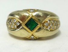 A heavy 18ct gold, emerald and diamond ring, finger size K1/2, approx 9.70gms.
