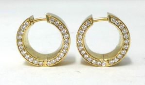 A pair of 18ct carat yellow gold creole hoop earrings, stamped .750, each with a channel set ow of