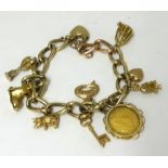 A gold charm bracelet including a Victoria half sovereign, total weight 44.50gms.