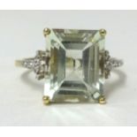 A 9ct gold large light green amethyst and diamond ring, finger size N.