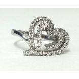 A pretty 18ct white gold heart shape ring set with diamonds, finger size R1/2