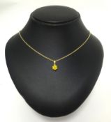A pendant set with a single round cut yellow diamond, approx 1.00 carats.