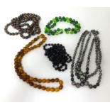 Two (plaited hair) watch chains also eight necklaces including amber style.