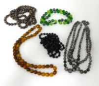 Two (plaited hair) watch chains also eight necklaces including amber style.