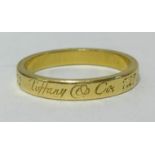 Tiffany, an 18ct yellow gold band ring with box and papers, purchased 2010, approx 3.60gms