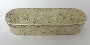 An Edwardian silver oblong box with import marks circa 1904 decorated with cherubs and scrollwork,