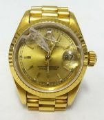 Rolex, a ladies 18ct gold Datejust, with guarantee, damaged glass.