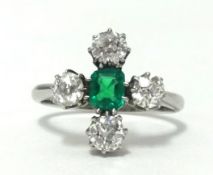 A platinum, emerald and diamond five stone ring, finger size M.