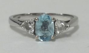 An 18ct white gold, heart shape diamond and aquamarine ring, finger size R.