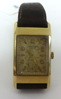Benson, a wristwatch with leather strap.