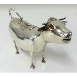 A late Victorian silver creamer in the form of a cow believed to be Dutch with English hallmarks,