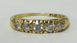 An 18ct gold, five stone diamond ring, finger size M 1/2.