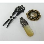 A Victorian silver and mother of pearl whistle, a mid Victorian memorium brooch with inscription 'In