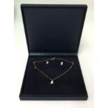 An 18ct gold and diamond set necklace with earrings on suite.