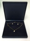 An 18ct gold and diamond set necklace with earrings on suite.