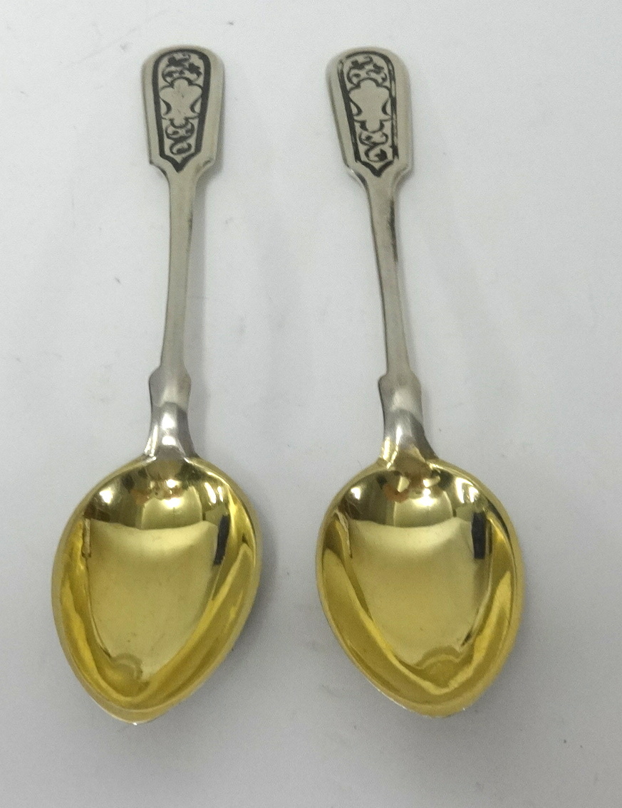 A pair of Russian neillo silver and gilt spoons, approx 99.60gms.
