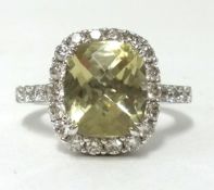 A large 18ct topaz and diamond cluster ring, the square shape topaz measuring approx 14mm x 12mm,