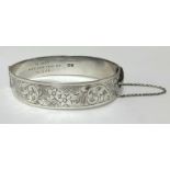 A silver bangle.