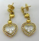 Chopard, a fine pair of 18ct Happy Diamonds, earrings, approx 10.10gms.