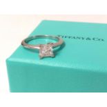 Tiffany, a fine diamond solitaire ring, set in platinum, the square shaped diamond assessed as VS1